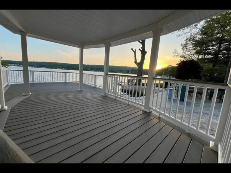 Gazebo overlooking lake at sunset.